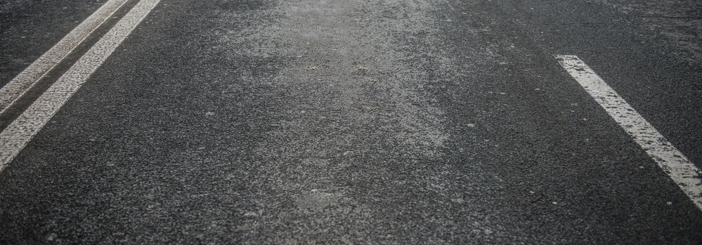 Asphalt road with white stripes